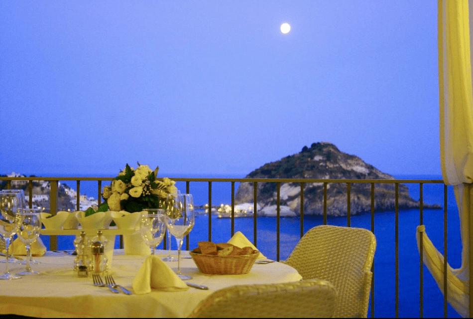 The stunning views from the restaurant of our yoga retreat venue overlooking Sant"Angelo, Ischia, Italy